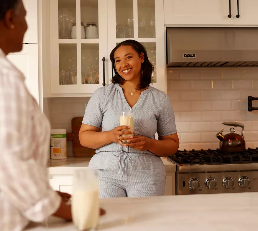 Women enjoying Formula 1 shakes at home