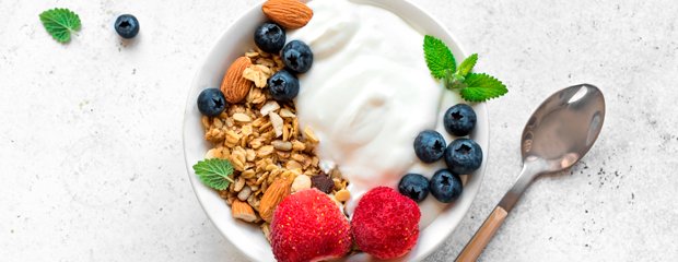 Healthy yogurth bowl with berries and grains