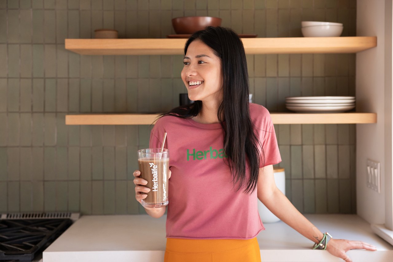 Girl smiling with an Herbalife shake