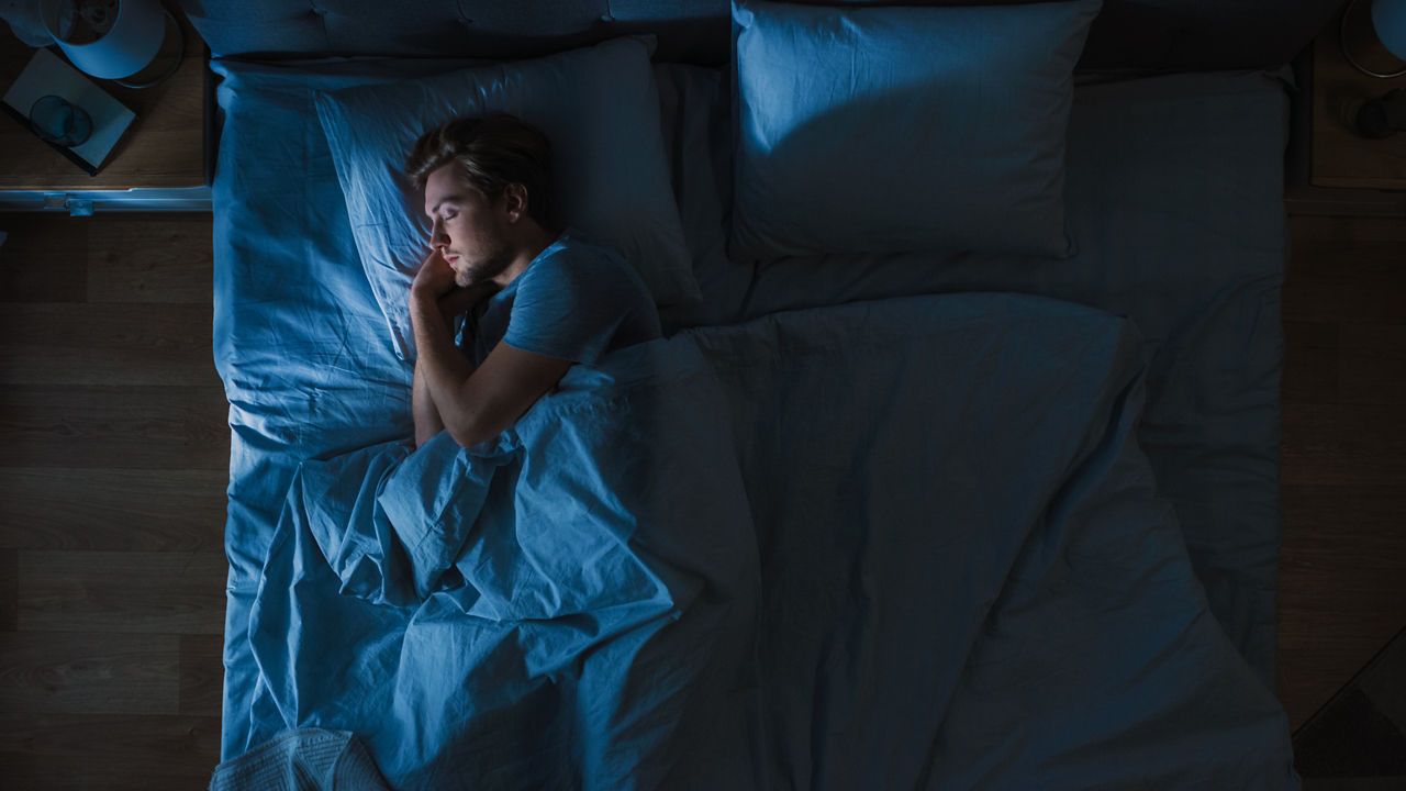 A man asleep in bed