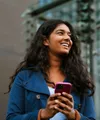 Woman on her phone smiling