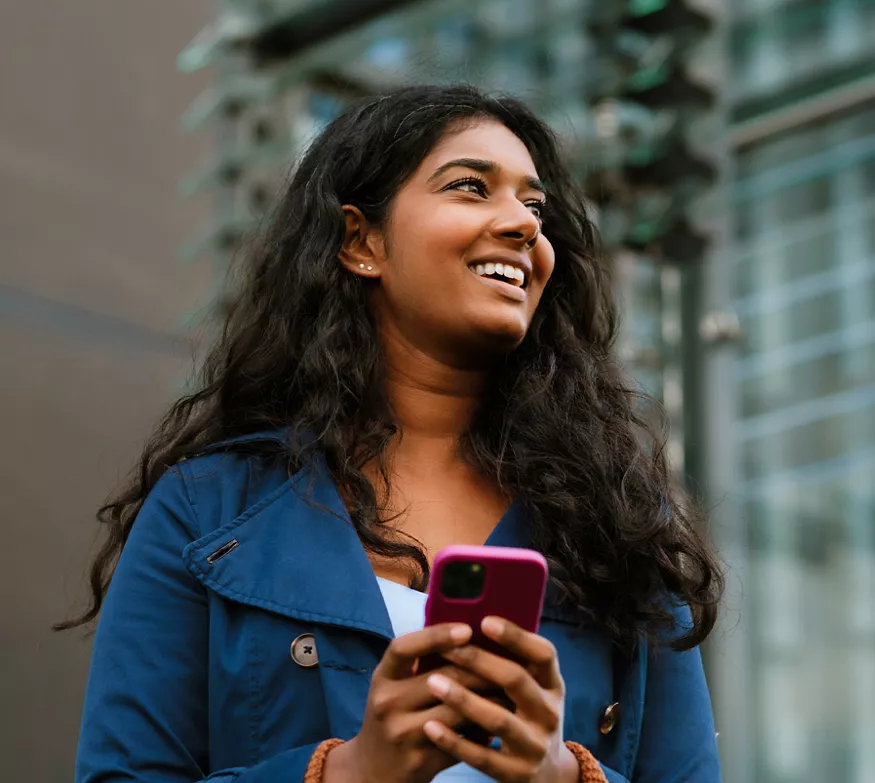 Woman on her phone smiling